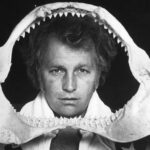 Evel Knievel peering through shark teeth, as part of promoting the Chicago Shark Jump.