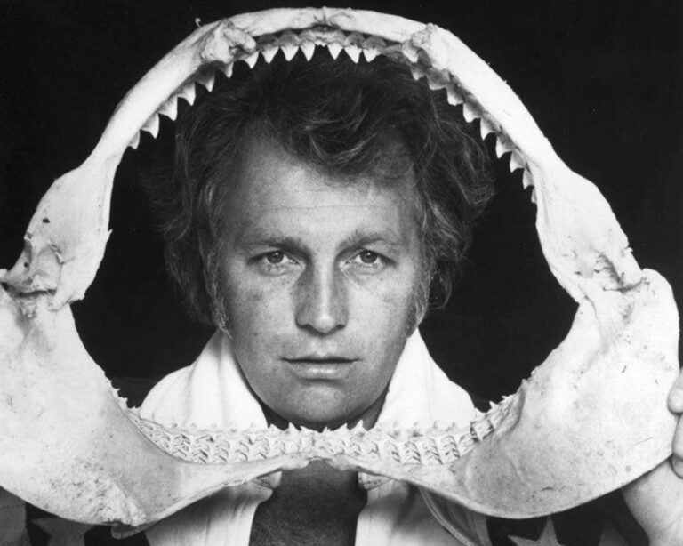 Evel Knievel peering through shark teeth, as part of promoting the Chicago Shark Jump.